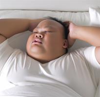 overweight-person-trying-to-sleep