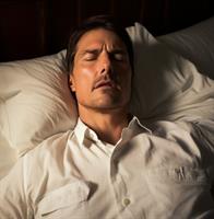 Tom Cruise in his bedroom, making lifestyle changes to reduce snoring