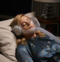 Image of Amy Poehler wearing a CPAP mask while sleeping
