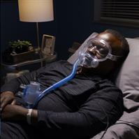 Image of Randy Jackson wearing a CPAP mask while sleeping